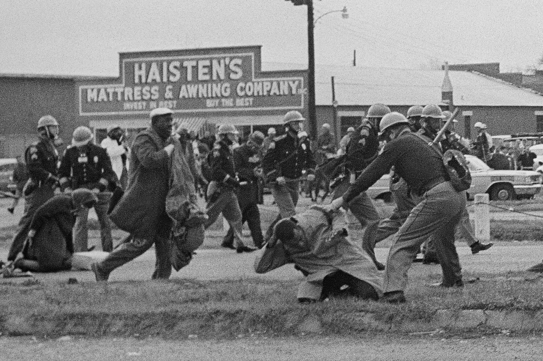 John Lewis being beaten by troopers at Selma, Ala., in 1965